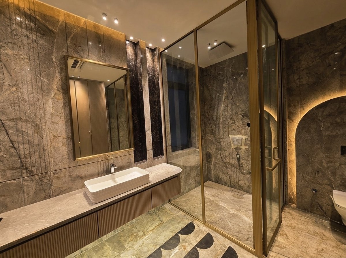 Gold-framed shower bathroom at Aalishan, South Extension