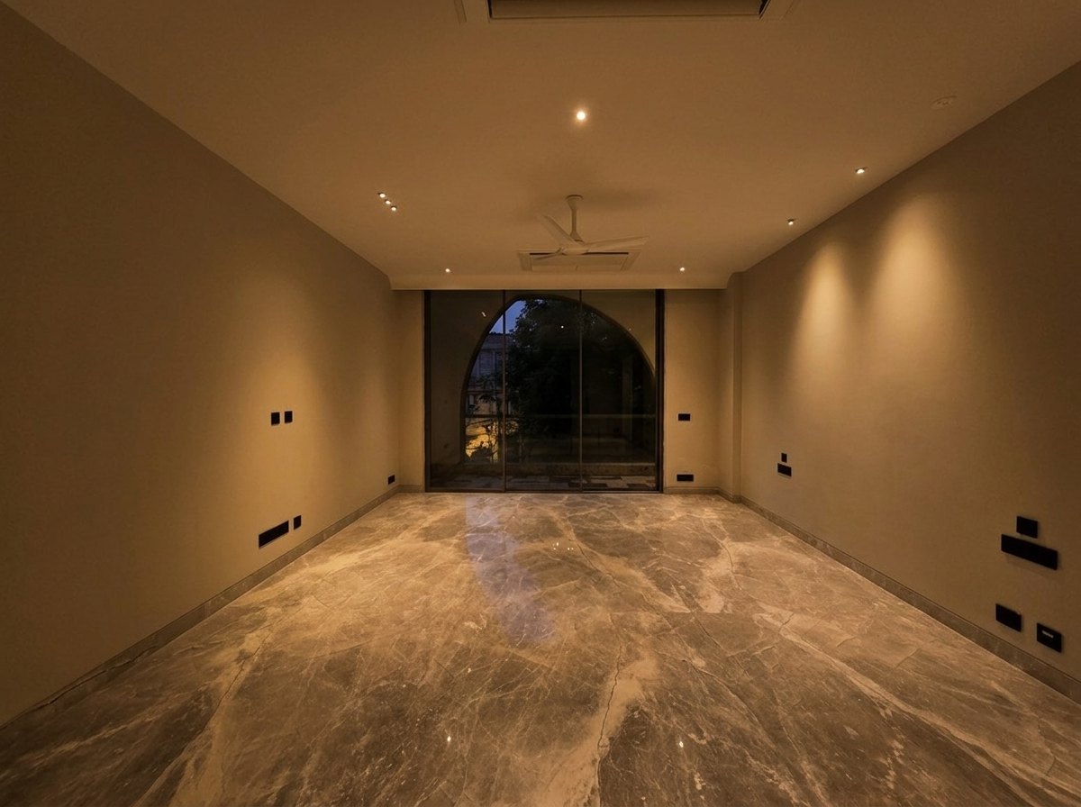 Reception with a tall arched window at Aalishan, South Extension