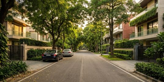 Anand Niketan builder floors on a tree-lined street in South Delhi