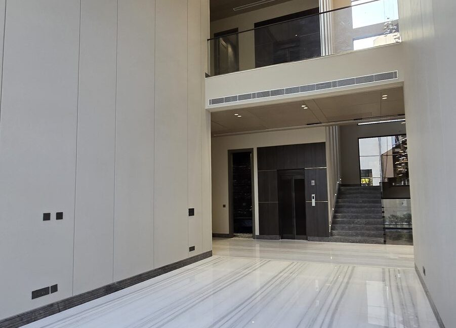 Double-Height Marble Lobby — Duplex in Chanakyapuri