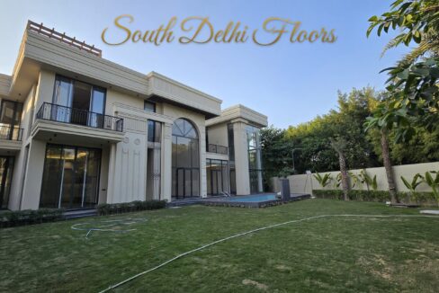 1,750 sq yard farmhouse for sale in Chattarpur, South Delhi — evening exterior with swimming pool and lawn