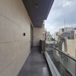 Balcony with a glass railing overlooking greenery in a builder floor in Chanakyapuri, Malcha Marg, South Delhi