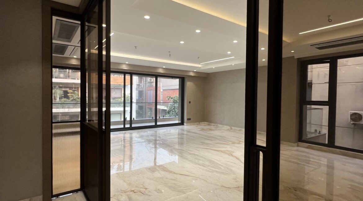 Metro Buildtech Living Room Through Glass Partition