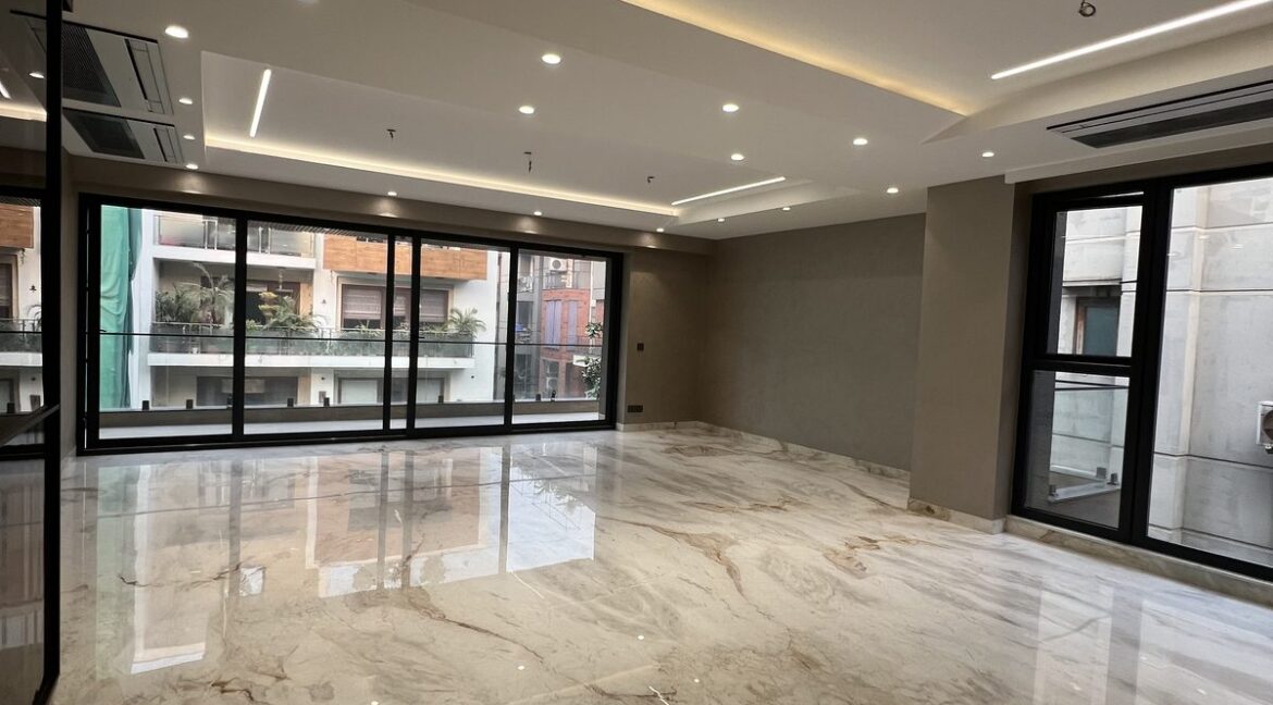 Metro Buildtech Spacious Living Area With Balcony Windows