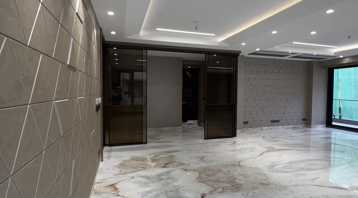 Metro Buildtech Tinted Glass Doors And Textured Wall