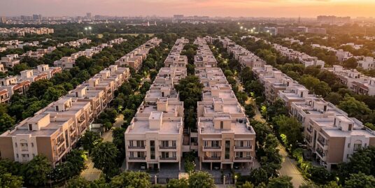 Delhi Master Plan 2047 — aerial view of South Delhi's leafy builder floor colonies at golden dusk