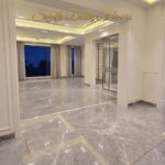 Dining room of the 4 BHK in Vasant Vihar, A Block, with a chandelier, Italian marble floor and cove lighting