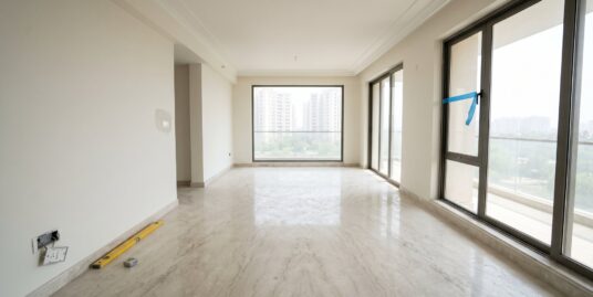 An empty newly finished builder floor apartment interior in South Delhi awaiting handover, with marble flooring and bare walls