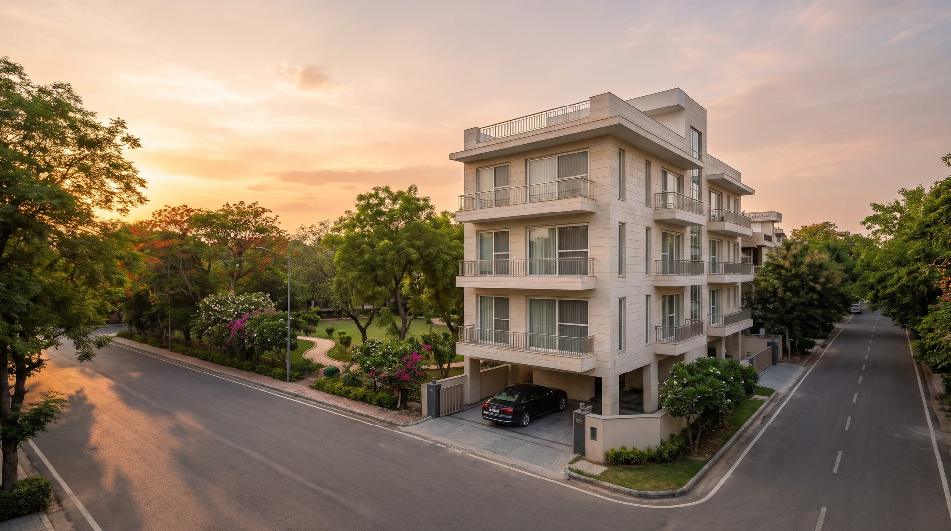 Corner builder floor in South Delhi facing a neighbourhood park, stilt parking plus four storeys at golden hour
