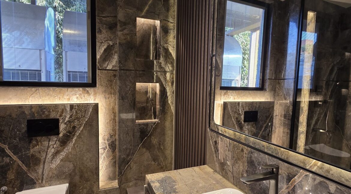 Ekum Homes Bathroom With Lit Shelf