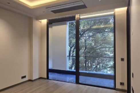 Ekum Homes Bedroom With Tray Ceiling And Tree View