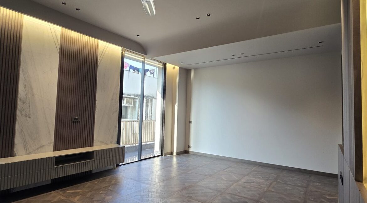 Ekum Homes Bedroom With TV Console And Balcony