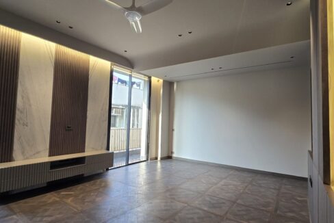 Ekum Homes Bedroom With TV Console And Balcony