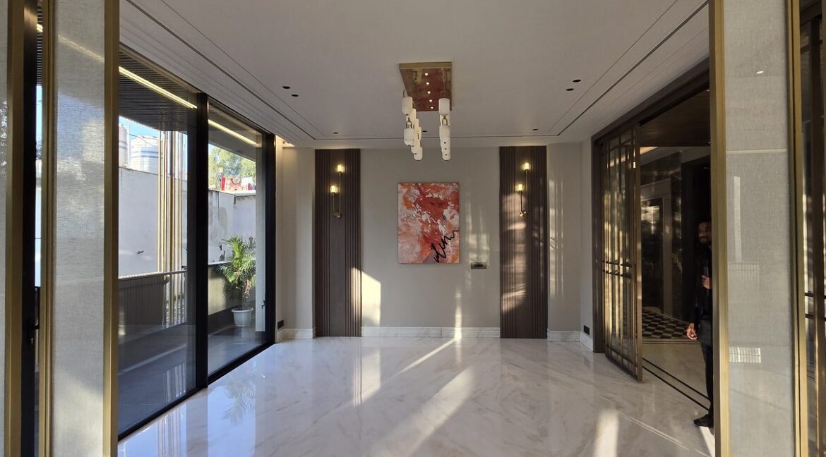 Ekum Homes Dining Area With Brass Screens