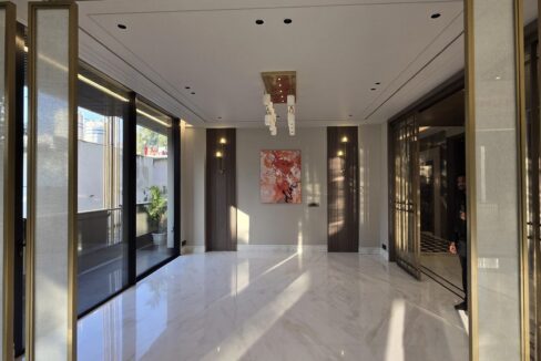 Ekum Homes Dining Area With Brass Screens