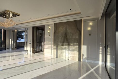 Ekum Homes Drawing Room With Marble Feature Wall