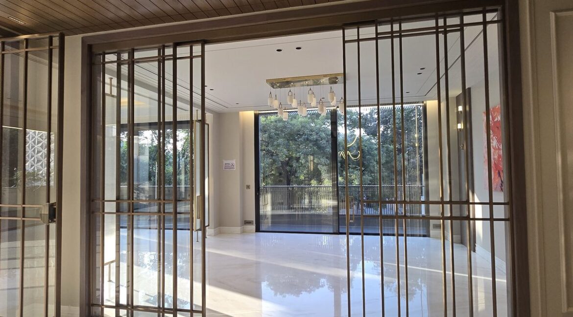 Ekum Homes Entrance With Bronze Grid Doors