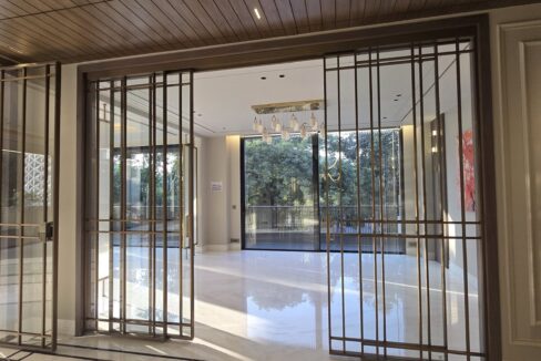 Ekum Homes Entrance With Bronze Grid Doors