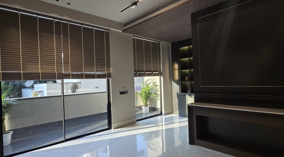Ekum Homes Family Lounge With TV Wall