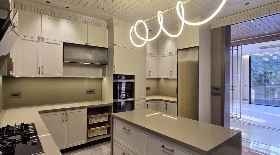 Ekum Homes Kitchen Island With Living Room View