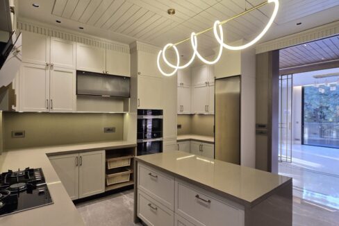 Ekum Homes Kitchen Island With Living Room View