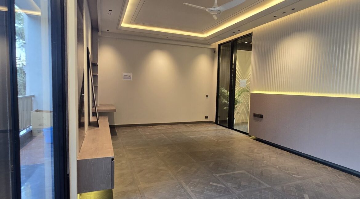 Ekum Homes Living Room With Sliding Glass Wall