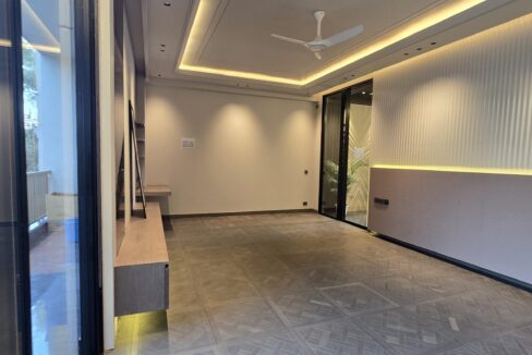 Ekum Homes Living Room With Sliding Glass Wall
