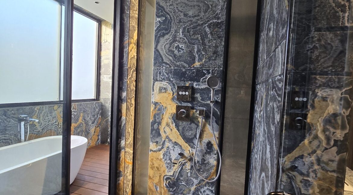 Ekum Homes Shower With Swirled Marble