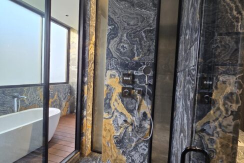 Ekum Homes Shower With Swirled Marble