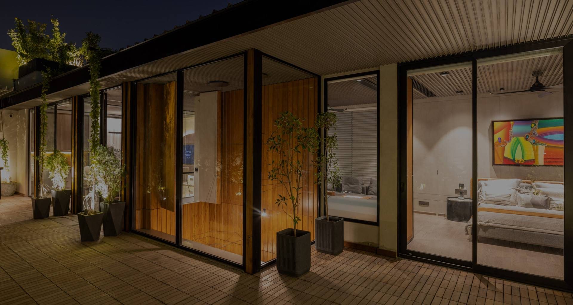 Evening view across a glazed courtyard of a Katarias (Kataria Buildcon) luxury residence in South Delhi