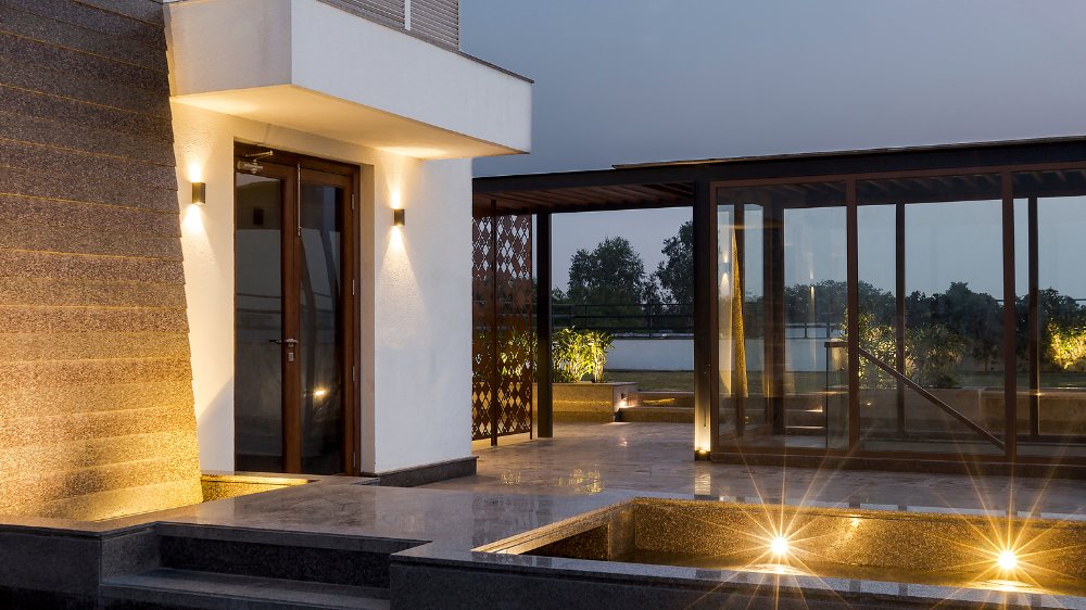 Dusk view of the pool terrace at S-236 Panchsheel Park, a Katarias (Kataria Buildcon) residence in South Delhi