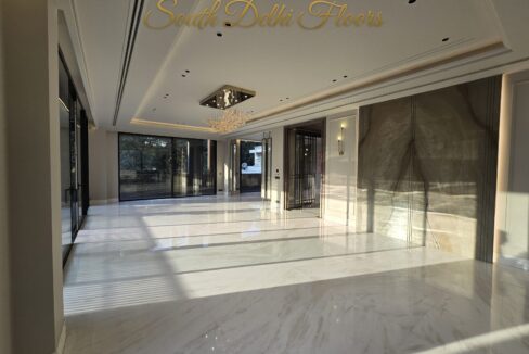 Bright marble living room finished by the developer, the standard planned for this park-facing duplex in Maharani Bagh