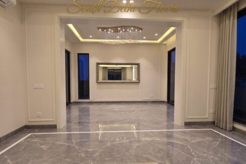 Lounge and dining vista of the park facing flat in Vasant Vihar, E Block, with Italian marble floors and cove lighting