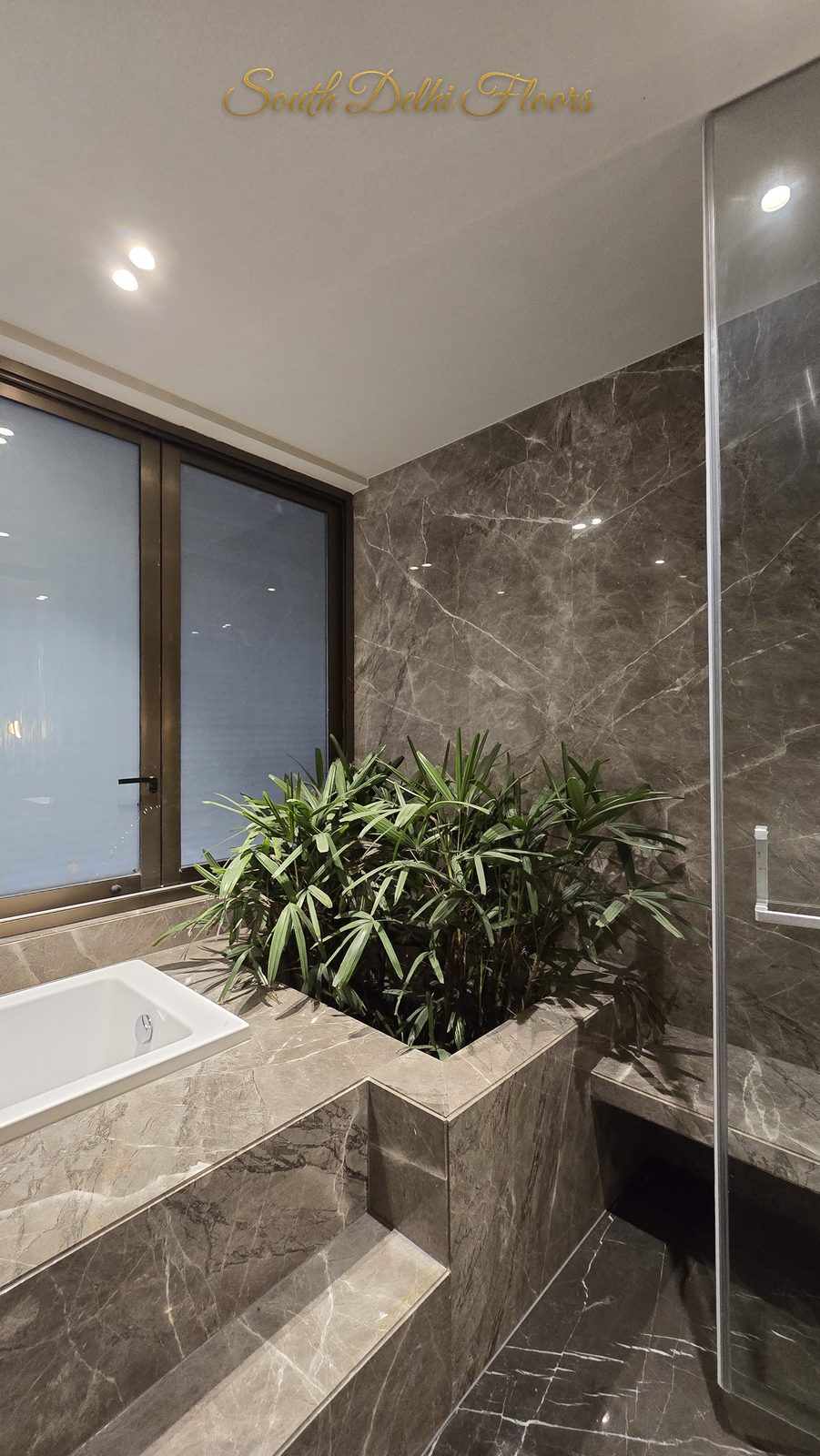 RS Buildtech Grey Marble Bathroom with Built-In Planter | Luxury Builder Floor by Ravinder Singh Marwah
