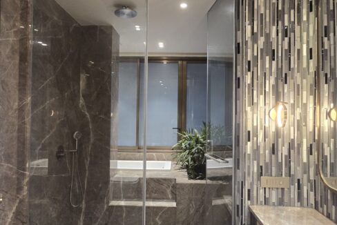 RS Buildtech Bathroom Walk-In Shower, Bathtub and Cane Vanity | Luxury Builder Floor by Ravinder Singh Marwah