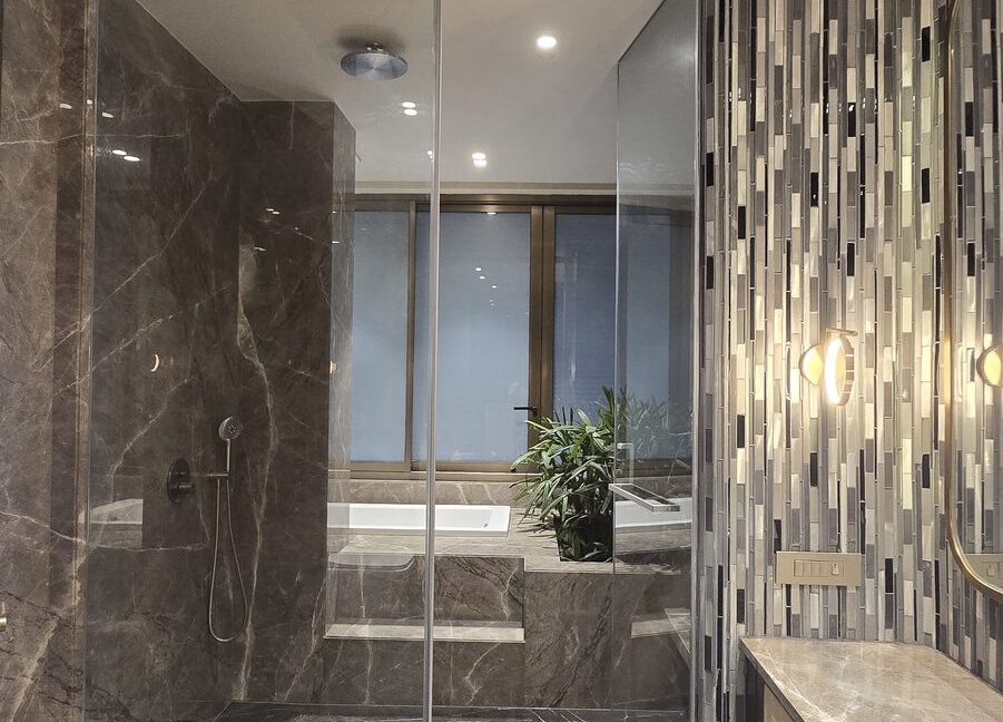 RS Buildtech Bathroom Walk-In Shower, Bathtub and Cane Vanity | Luxury Builder Floor by Ravinder Singh Marwah
