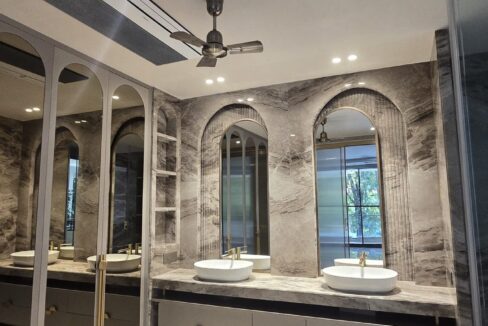 RS Buildtech Bathroom Twin Arched Mirrors in Grey Marble | Luxury Builder Floor by Ravinder Singh Marwah