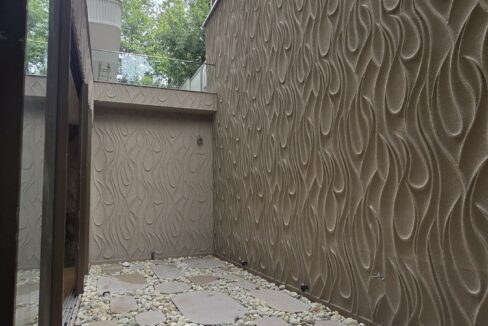RS Buildtech Courtyard with Wave Relief Walls | Builder Ravinder Singh Marwah