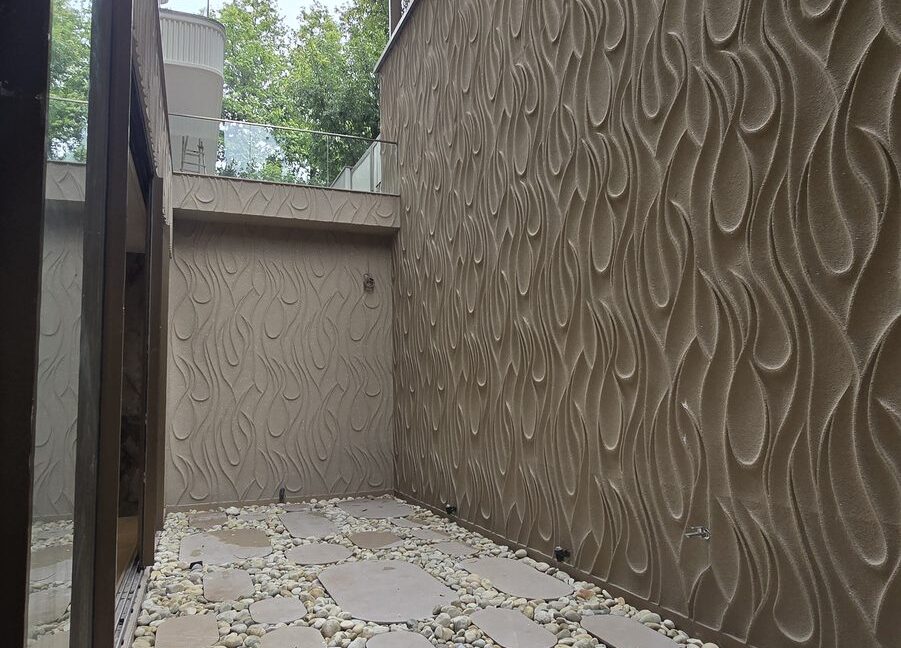 RS Buildtech Courtyard with Wave Relief Walls | Builder Ravinder Singh Marwah