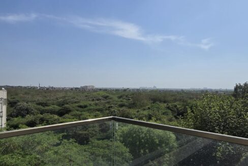RS Buildtech Glass Balustrade with Panoramic Green Views | Builder Ravinder Singh Marwah