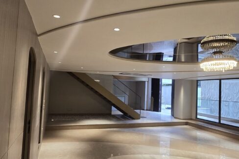RS Buildtech Lounge with Tiered Crystal Chandelier | Luxury Property by Ravinder Singh Marwah