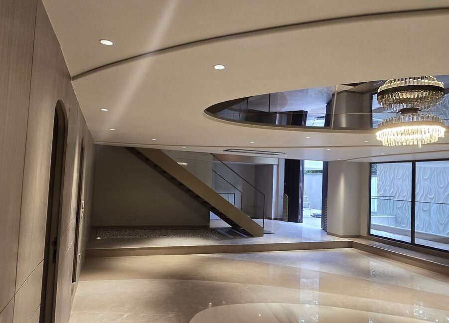 RS Buildtech Lounge with Tiered Crystal Chandelier | Luxury Property by Ravinder Singh Marwah