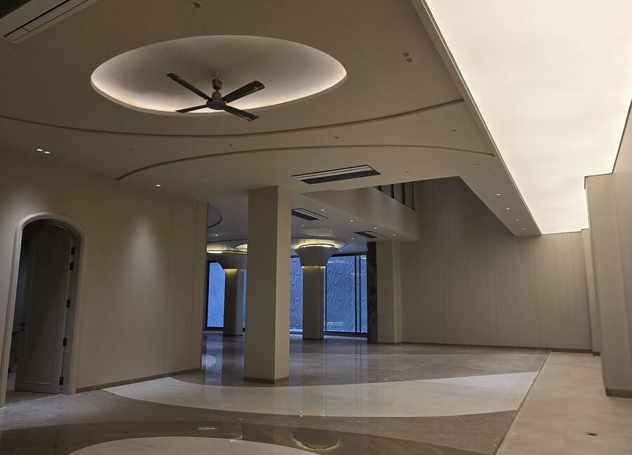 RS Buildtech Open-Plan Hall with Circular Floor Inlay | Luxury Builder Floor by Ravinder Singh Marwah