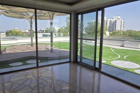 RS Buildtech Penthouse Lounge with Corner Glass Doors | Luxury Property by Ravinder Singh Marwah