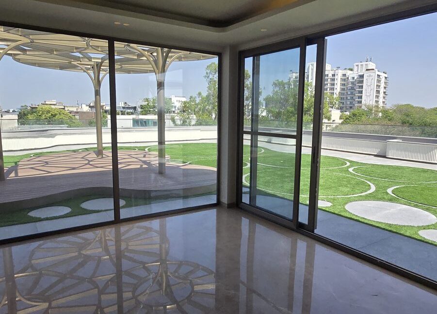 RS Buildtech Penthouse Lounge with Corner Glass Doors | Luxury Property by Ravinder Singh Marwah