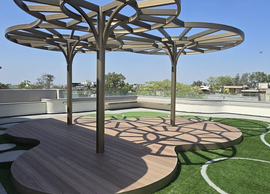 RS Buildtech Pergola Cluster over Curved Wooden Deck | Luxury Builder Floor by Ravinder Singh Marwah