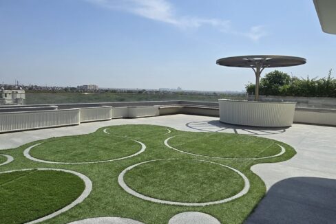 RS Buildtech Rooftop Lawn with Granite Disc Inlays | Builder Ravinder Singh Marwah
