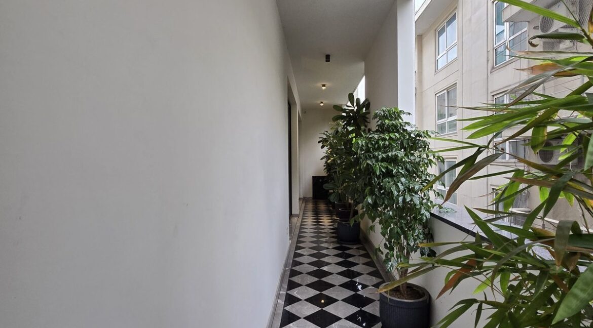Windchimes Construction Balcony Checkered Floor - Amrit Lal