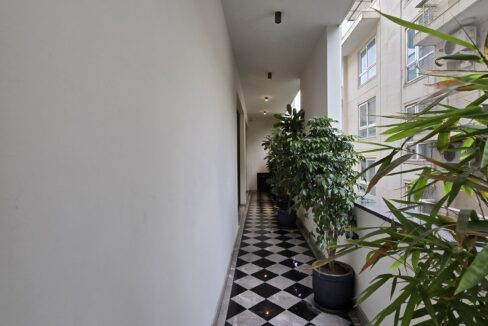 Windchimes Construction Balcony Checkered Floor - Amrit Lal