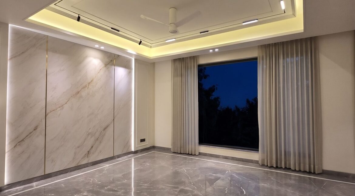 Windchimes Construction Bare Drawing Room Marble Wall At Night - Surbhi Nandrajog